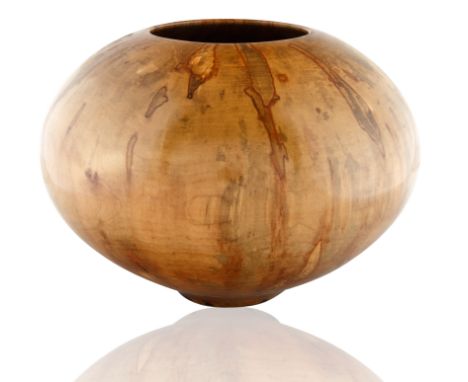 circular form, the body with the organic wood grain, the natural coloring of gold and yellow hues accented with dark and ligh