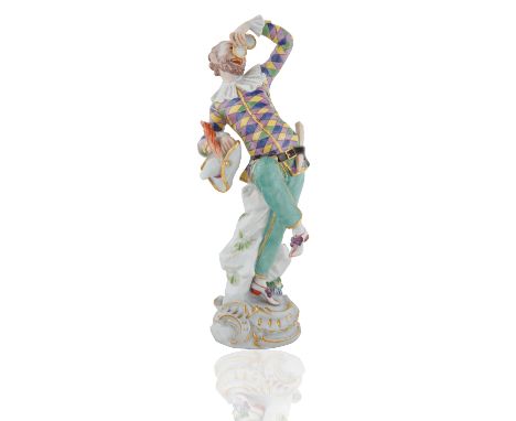 modelled after J.J. Kaendler and based on Italian Commedia dell'Arte 'Pulcinella Figure', on a gilt-edged, scroll moulded bas