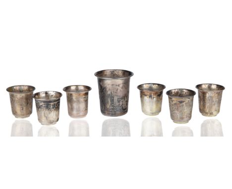 comprising six smaller and one larger vodka cups, each with a pair of roundels featuring fortified towers, with stylized foli