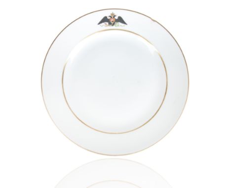 circular, with gilt rim the cavetto with an imperial eagle in black, against a white ground,green underglaze imperial cypher 