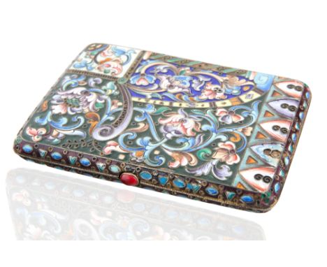 rectangular, with rounded corners, decorated overall with scrolling floral designs within geometric borders, with cabochon ru