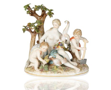 modelled after J.J. Kaendler, atop a mound moulded naturalistic base with gilt-edging, Mother Earth seated holding a cornucop