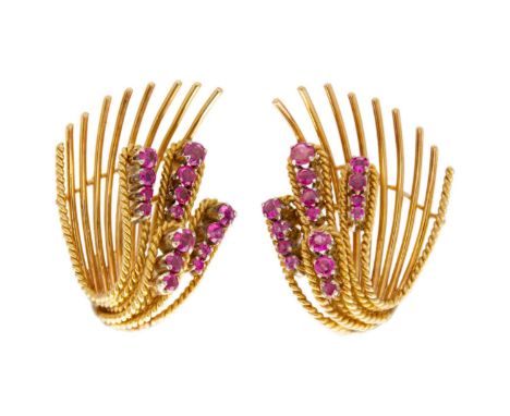 A pair of 18ct (tested) mid-century ruby set clip earrings. Of stylised wheat sheaf design, each set with 15 round cut gradua