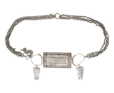 An Omani silver rectangular amulet with chain. Total length 84cm, amulet 8.5 x 4.5cm.