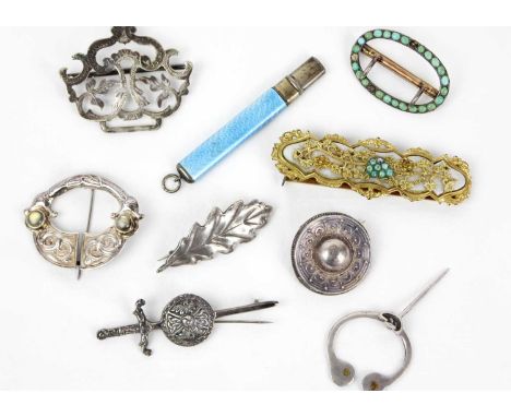 A collection of silver brooches, two Victorian buckles and a guilloche enamel case pencil A silver etruscan revival mourning 