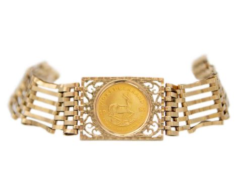A 9ct six bar gate link bracelet with 1/10 Krugerrand coin. The bracelet has a padlock clasp with hallmark, 14.59g.