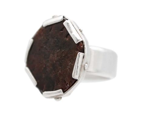 HELEN FEILER - A silver garnet specimen set ring. The panel head measuring 25 x 24mm, size M, 22.5g.