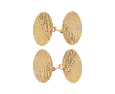 A pair of 9ct engine turned oval cufflinks. Birmingham 1963, 4.1g.