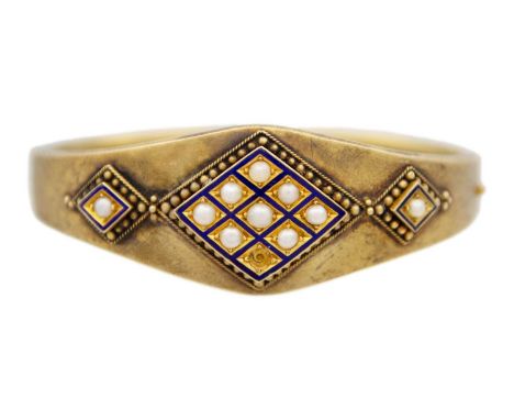 A high purity (tests 14ct) gold Etruscan revival hinged bangle Set with natural cultured half pearls and enamel, granulation 