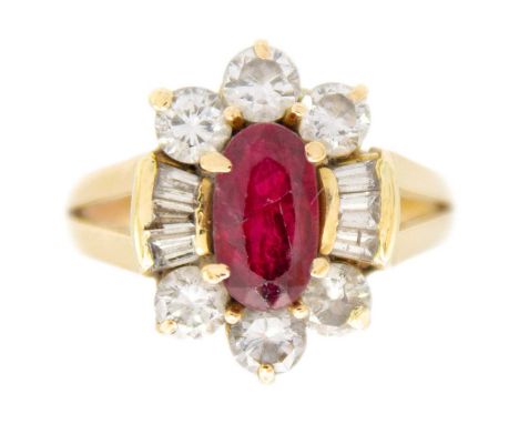 A modern Chinese 18ct ruby and diamond cluster ring. The oval cut ruby of 0.85ct estimated weight, surrounded by six 0.10ct r