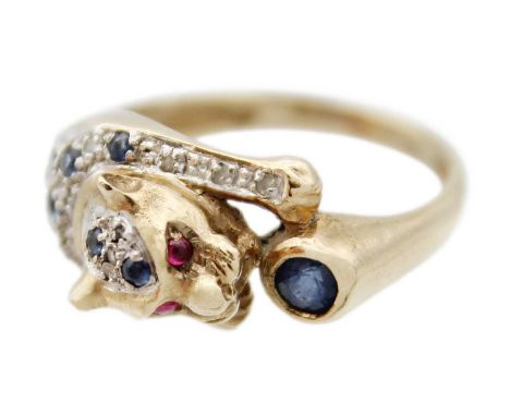 A 9ct leopard design ring set with diamonds, sapphires and cabochon ruby eyes. London import hallmark 1990, size M 1/2, 4.5g.