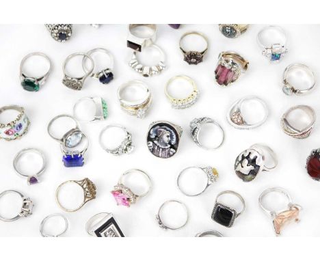 A collection of silver stone and paste set rings. Including a silver gilt ring set with white and blue diamonds, size O 1/2, 