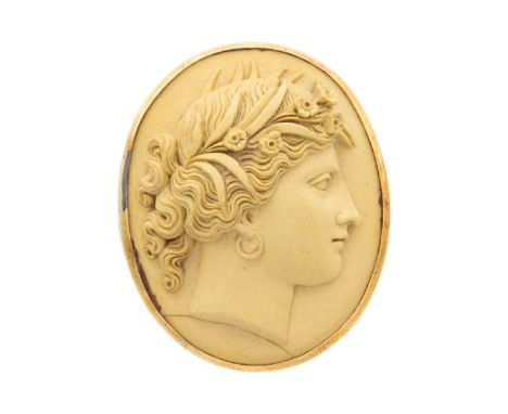 A rose gold mounted lava cameo brooch. Carved in relief with a side portrait of a classical lady, 3.8cm x 3cm.