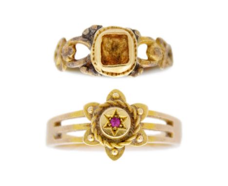 Two antique gold rings. One is Victorian, tested as 14ct, applied with a flower and set a tiny ruby, size Q, 3.2g; the other 