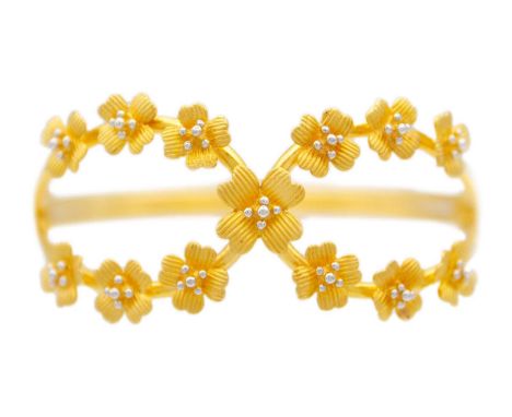 High purity gold bangle applied with flower heads Stamped 916, 26.88g weight. Comes in original Alukkas jewellery box, Quatar