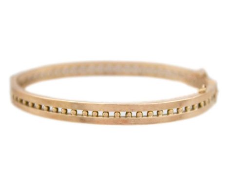 A 9k rose gold bangle bracelet The bangle is 5.7x4.6cm in inner width, 7.78g, stamped 9k.