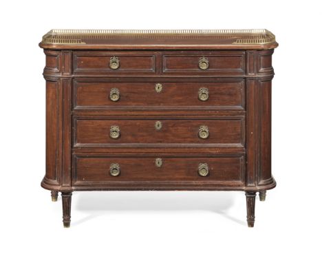 A small 19th century mahogany commodeIn the French tasteThe pierced three-quarter gallery above two short and three long draw