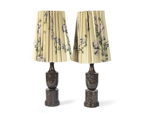 A pair of late 19th century serpentine marble urn ornaments,Later converted to lamp bases with pleated floral paper shades.Fi