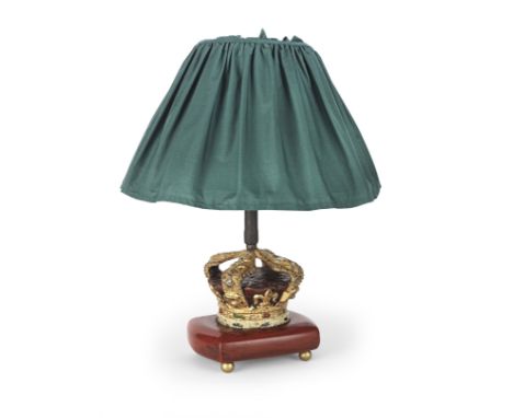 An early 20th century painted metal coronet finial, later mounted as a table lampOn a footed red painted wood base with fabri