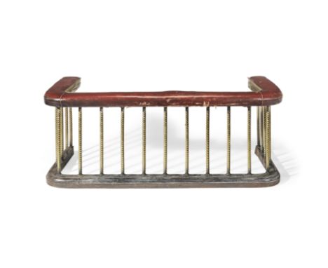 A late 19th century brass, steel and red leather upholstered club fenderOf typical design with spiral twist supports, 148cm w