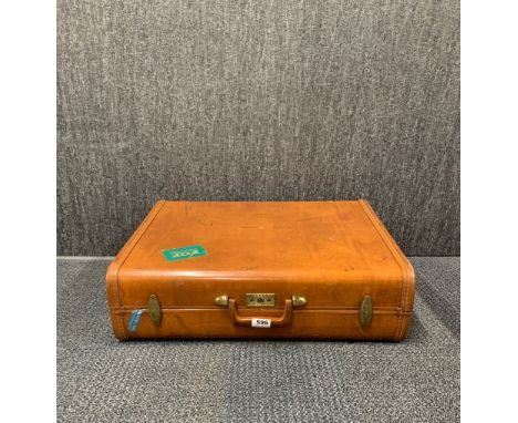 A vintage leather suitcase, 62 x 20 x 50cm.