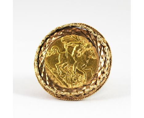 A 9ct yellow gold mounted half sovereign ring, c. 1925, (K.5), approx. 8.1gr.&nbsp;