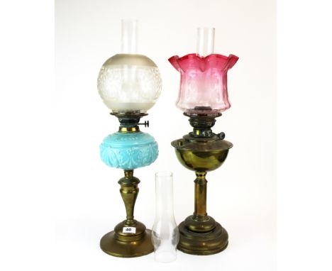 A 19th century brass and blue opaline glass oil lamp with frosted glass shade, together with a further brass oil lamp convert