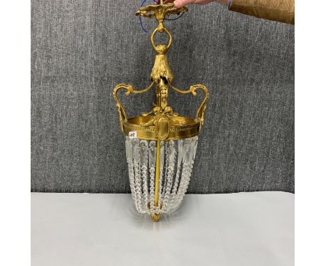 A gilt metal and cut glass chandelier light fitting, H. 70cm.