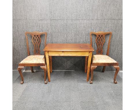 A pair of Chippendale style ball and claw feet upholstered chairs, together with a wooden kitchen table, 95 x 48cm.