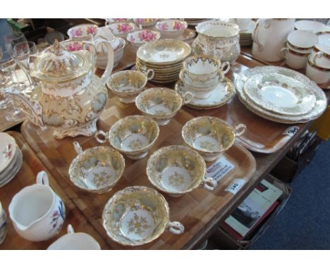 Two trays of 19th Century Staffordshire gilt foliate teaware comprising: teacups and saucers; teapot; plates etc. together wi