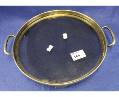 Silver two handled tray surround raised on three feet with drop in glass tray, Sheffield hallmarks, maker's initials: E.V. 