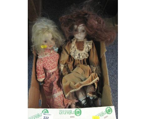 Two ceramic dolls in fitted clothing (unmarked) (2)