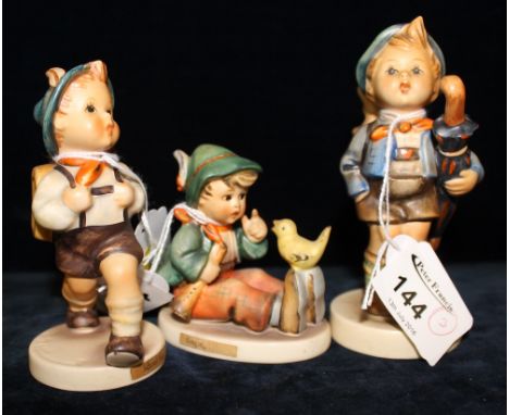 Three West German Goebel Hummel figures: 'Schoolboy singing' and 'Boy with Umbrella'.  (3) CONDITION REPORT: No obvious damag