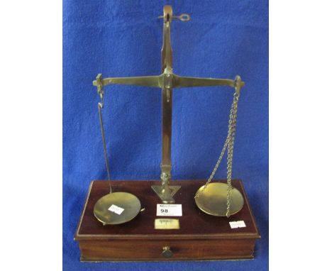 Set of 19th Century brass apothecary's scales, on a mahogany draw base containing various weights.