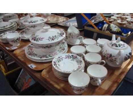 Three trays of Wedgwood bone china 'Hathaway Rose' tea and dinnerware items comprising: teapot; cups; saucers; various plates