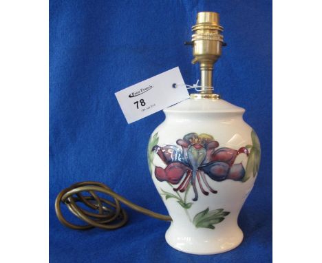 Moorcroft Art Pottery lamp base decorated with tube lined flowers and foliage on a cream ground.  Impressed marks with painte