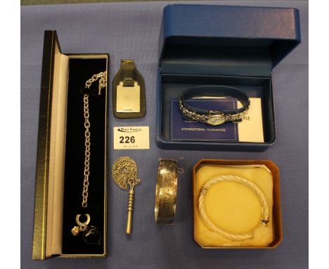 Selection of jewellery to include: silver engraved key fob; engraved silver bangle; silver Italian spiral bangle; silver trun
