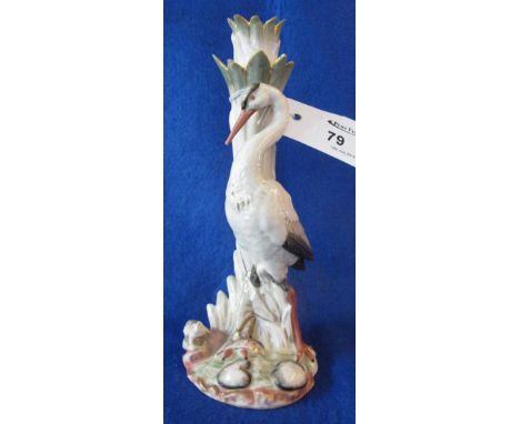 Continental porcelain candlestick mounted with stork and frog amongst foliage.  Initials: R.W. within crowned shield to the u
