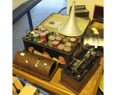 An Edison 'Home Phonograph' in bentwood oak case, with aluminium horn, together with a small tin trunk of assorted cylinders 