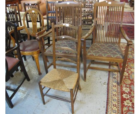 Pair of Edwardian oak open arm elbow chairs together with an early 20th Century oak elbow chair and a ladder back bedroom cha