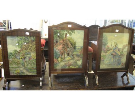 Three similar mahogany framed tapestry fire screens.  (3)