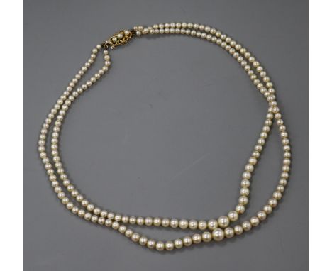 A double strand graduated cultured pearl necklace, with 9ct gold and cultured pearl clasp, 42cm.