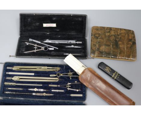 A silver and mother of pearl fruit knife, crocodile wallet and drawing instruments