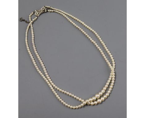 A double strand graduated cultured pearl choker necklace with diamond set 9ct white gold clasp, 38cm.