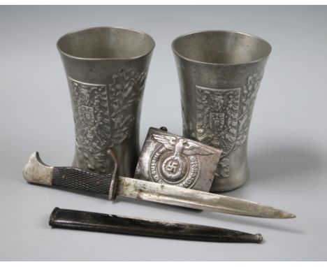 Two pewter armorial cups and a dagger