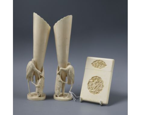 A pair of carved ivory Chinese vases and a carved ivory card case (3)