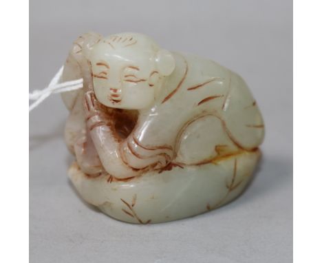 A Chinese jade figure of a crouching boy 4.5cm.