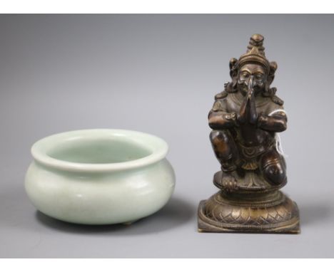 A Chinese celadon glazed tripod censer and a bronze figure of Garuda