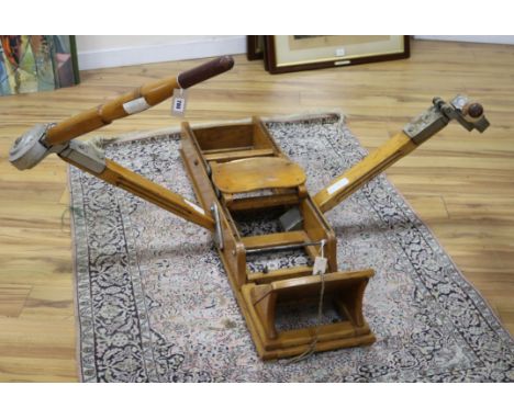 A vintage rowing machine retailed by Panarotto of Vicenza W.122cm