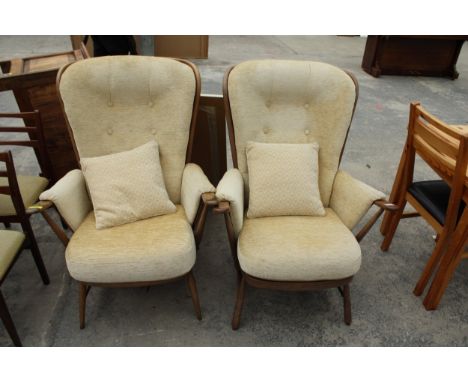 A PAIR OF ERCOL BLUE PAPER LABEL EVERGREEN HIGH BACK FIRESIDE CHAIRS 